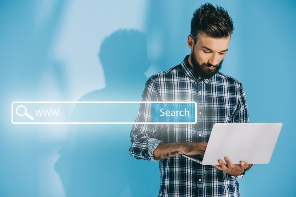 WEB OPTIMIZED bearded developer using laptop on blue with websi 2026 03 12 23 56 46 utc