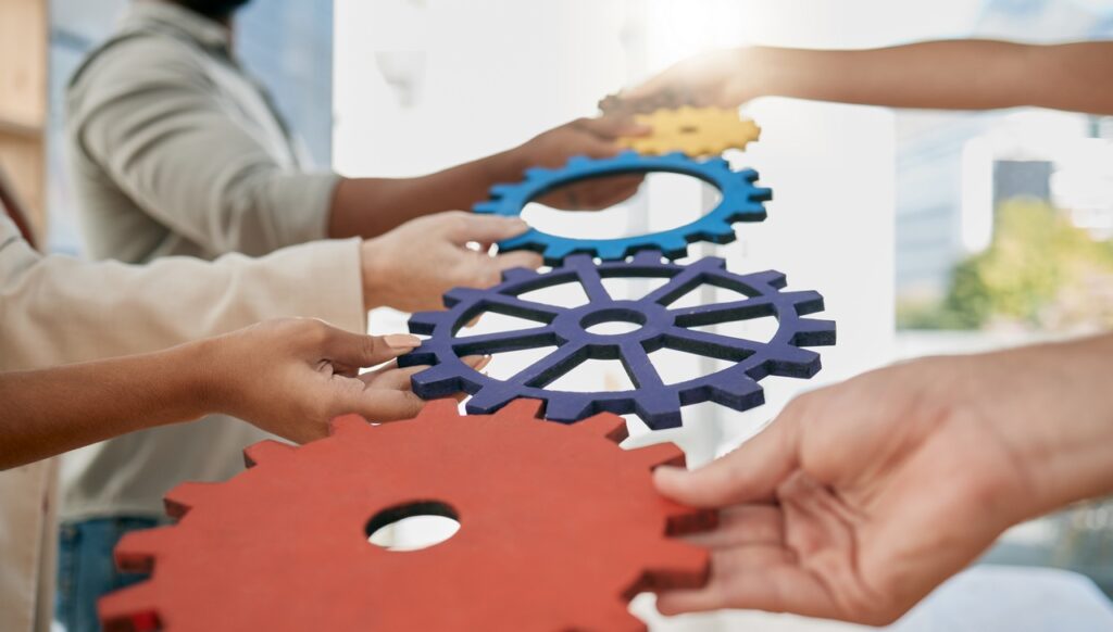 WEB OPTIMIZED business people toys and gears at job for teamwor 2026 03 25 02 43 43 utc